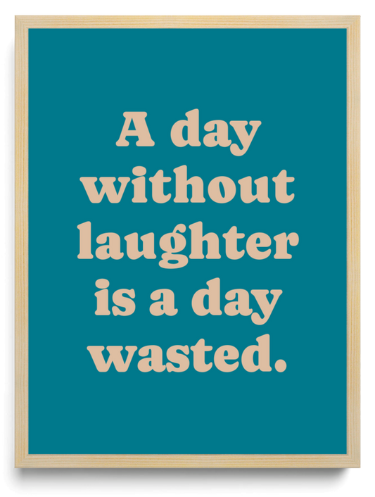 A day without laughter is a day wasted framed typographic print